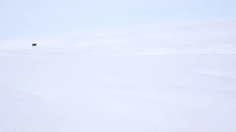 Preparing runway on the glacier with catepillar tractor and special equipments Stock Footage 92169720
