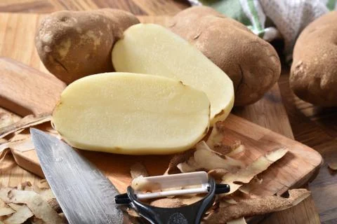 Preparing russet potatoes Stock Photos