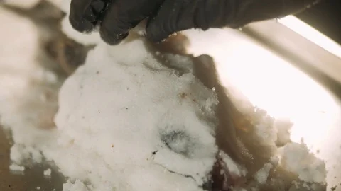 Preparing salt-crusted fish Stock Footage 125458620