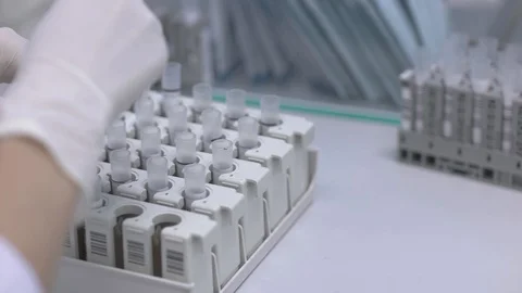 Preparing sampling tubes before putting in the machine Stock Footage 129502316