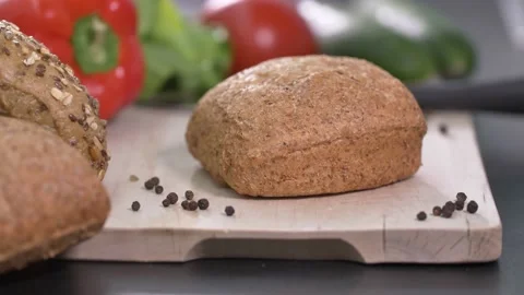 Preparing sandwich on breakfast table full of vegtables.  Stock-Footage 138387418