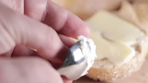 Preparing sandwich on breakfast table full of vegtables.  Vídeos de archivo 154458531