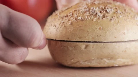 Preparing sandwich on breakfast table full of vegtables.  Vídeos de archivo 154458782