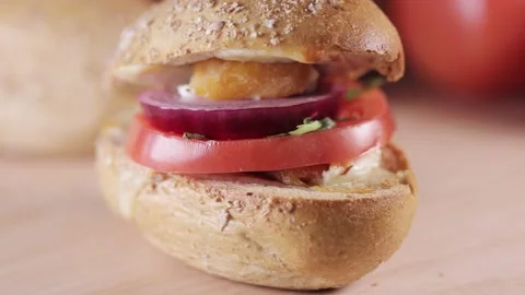 Preparing sandwich on breakfast table full of vegtables.  Vídeos de archivo 154458835