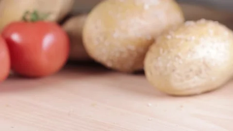 Preparing sandwich on breakfast table full of vegtables.  Vídeos de archivo 154459258