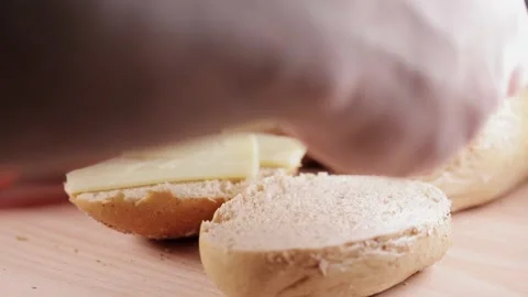 Preparing sandwich on breakfast table full of vegtables.  Vídeos de archivo 154459281