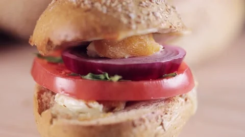 Preparing sandwich on breakfast table full of vegtables.  Vídeos de archivo 154459286