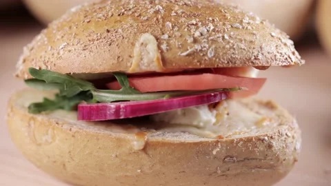 Preparing sandwich on breakfast table full of vegtables.  Vídeos de archivo 154459395