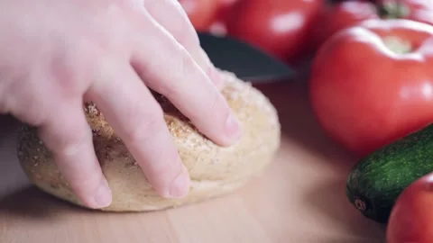 Preparing sandwich on breakfast table full of vegtables.  Vídeos de archivo 154460505