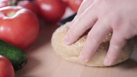 Preparing sandwich on breakfast table full of vegtables.  Vídeos de archivo 154460508