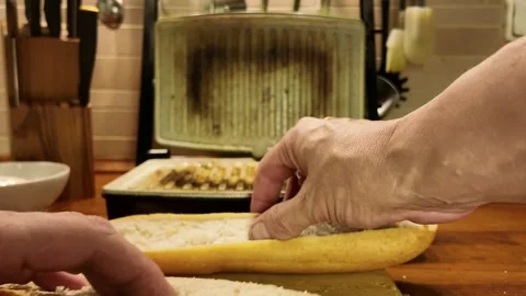 Preparing a sandwich by placing bread slices into a grill press Stock Footage 340110428
