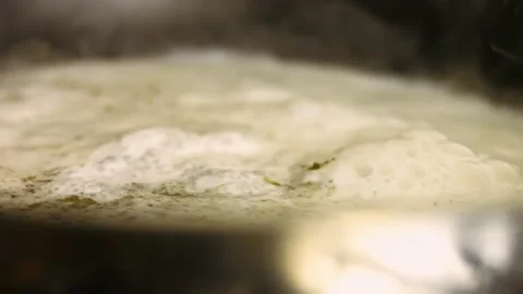 Preparing the sauce for oven roasted chicken. Mixing with wooden spatula Stock Footage 151430243