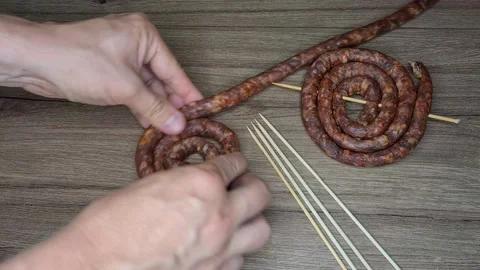 Preparing sausages for barbecue Stock Footage 165505013