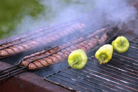 Preparing sausages on fire Stock Photos