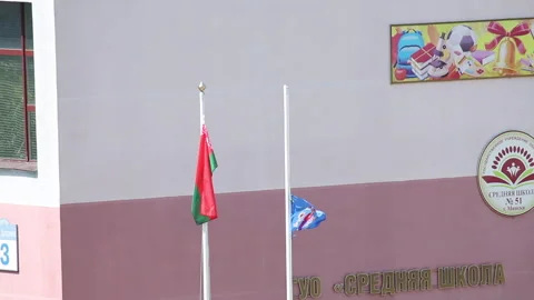 Preparing for the school graduation celebration. The flag of the country and  Stock Footage 132413109