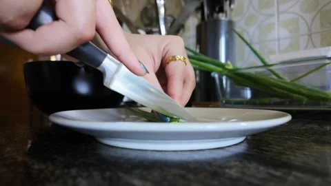 Preparing scrambled eggs and chives for breakfast Stock Footage 335592299