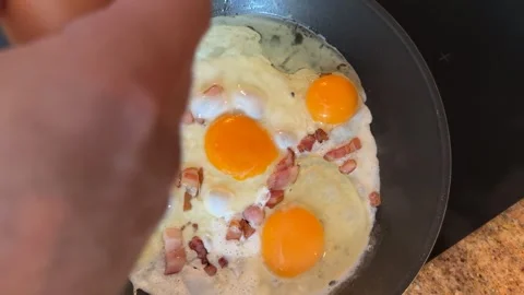 Preparing Scrambled Eggs with Bacon for Breakfast Stock-Footage 278168113