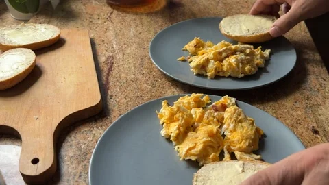 Preparing Scrambled Eggs with Bacon for Breakfast Stock-Footage 278168681