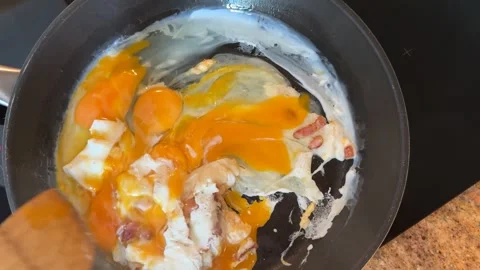 Preparing Scrambled Eggs with Bacon for Breakfast Stock-Footage 278171036