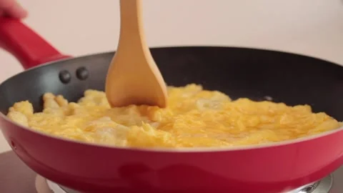 Preparing scrambled eggs Stock Footage 133815059