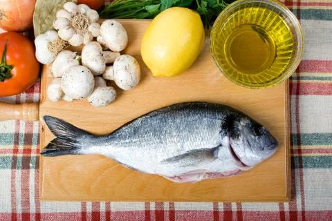 Preparing sea bream Stock Photos