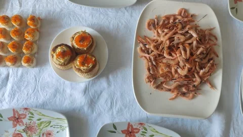 Preparing a seafood buffet with shrimp and caviar appetizers Stock Footage 341512682