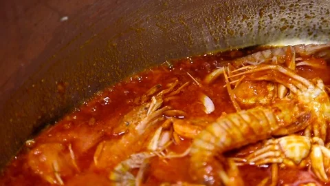 Preparing of seafood in a red sauce. Close up Stock Footage 74523414