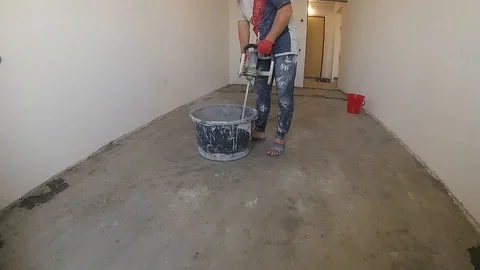 Preparing a self-leveling floor Stock Footage 123817494