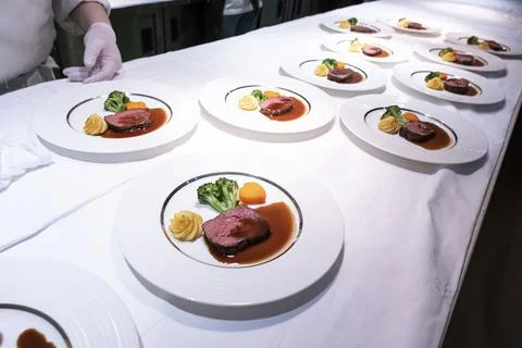 Preparing to serve the main dish beef fillet Stock Photos