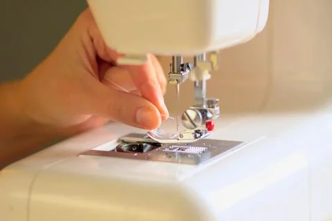 Preparing the sewing machine for work. Close up view. 스톡 사진