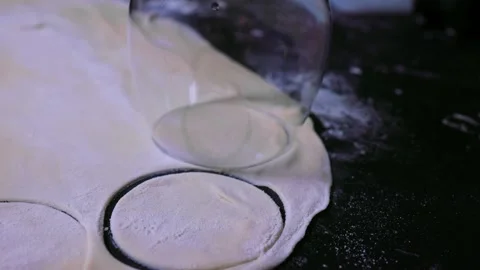 Preparing the shape of a circle of dough for a dumpling dish Stock Footage 195838215