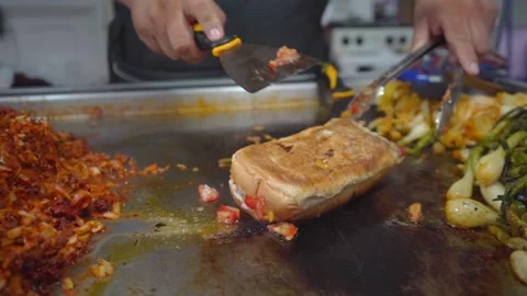 Preparing a shepherd's pie on the griddle Stock Footage 295387047