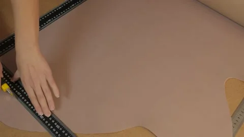 Preparing the skin for work. Marking and cutting of genuine leather. Stock Footage 169285708