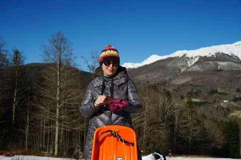 Preparing for Sledding on a Winter Day Stock Photos