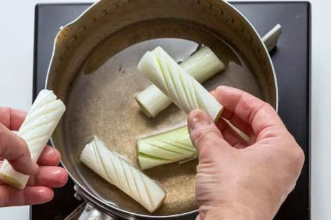 Preparing sliced onion for cooking in the kitchen Stock Photos