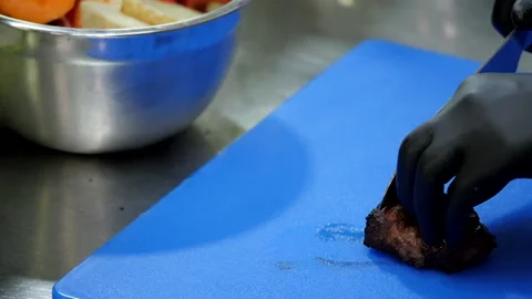 Preparing for Slicing Meat Stock Footage 131633872