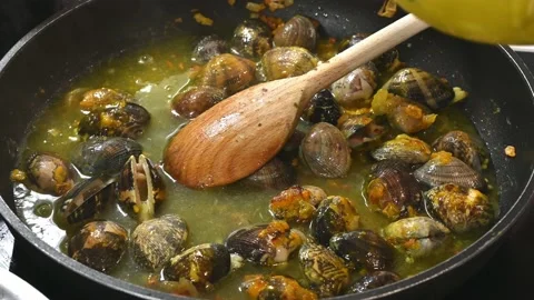 Preparing some delicious clams with onion Stock Footage 219717512