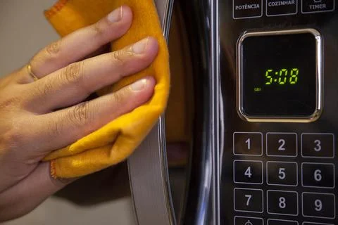 Preparing a soup in the microwave Stock Photos