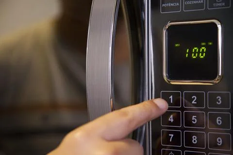 Preparing a soup in the microwave Stock Photos