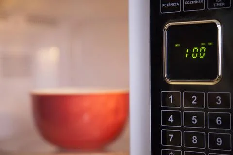 Preparing a soup in the microwave Stock Photos