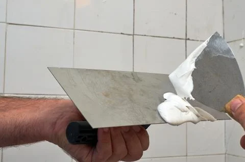 Preparing spackling compound Stock Photos