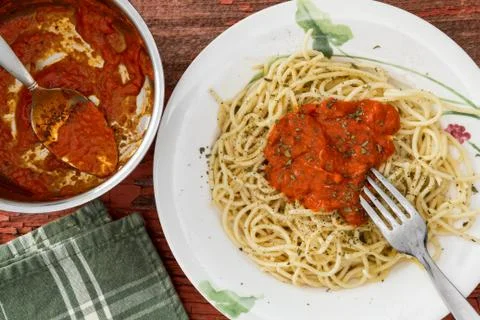 Preparing spaghetti pasta with sauce Stock Photos