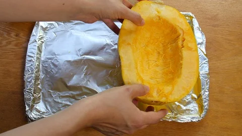 Preparing spaghetti squash to go into the oven. Stock Footage 106607452