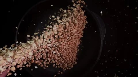 Preparing split yellow peas for cooking in the kitchen in super slow motion Stock Footage 282523142