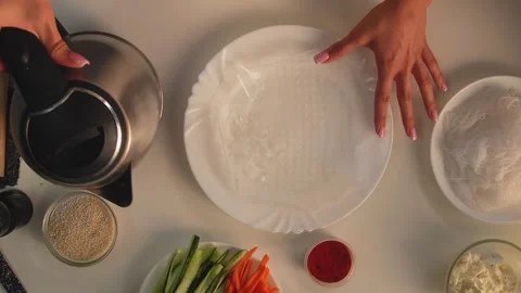 Preparing Spring Rolls in a Home Kitchen Setup Stock Footage 319787359