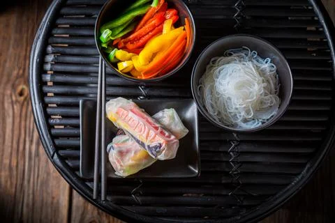 Preparing spring rolls made of vegetables. Vietnamese cuisine. Stock Photos