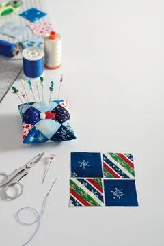 Preparing of square pieces of fabrics for sewing quilt, pincushion,  sewing.. Fotos Stock