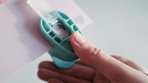 Preparing for St. Valentines Day, making heart shaped paper confetti Stock Footage 326243713