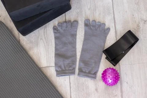 Preparing to start exercising with expander tape, myofascial relaxation ball, Stock Photos