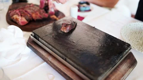 Preparing steak on the hot stone Stock Footage 204809679